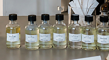 Labelled fragrance sample vials from formula development at the Yevfumes studio